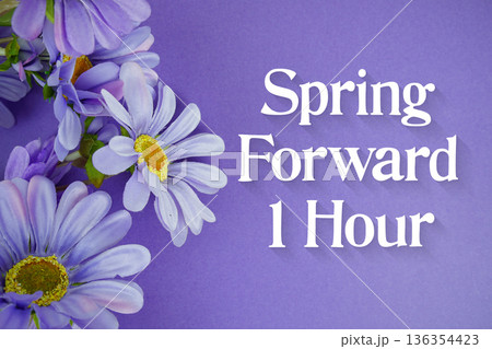 Spring Forward 1 Hour Daylight Savings Time message with bunch of flowers on purple background 136354423