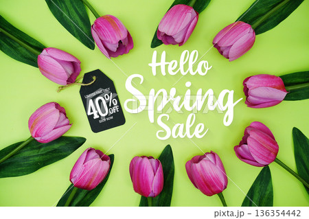 Hello Spring Sale and Price tag 40% off  with tulip flowers on green background 136354442