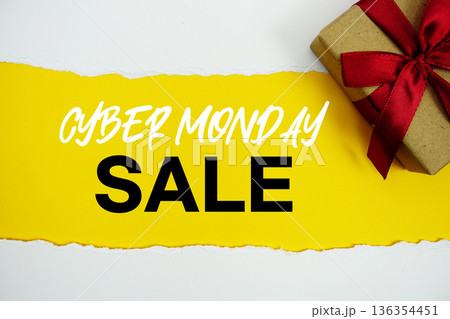 Cyber Monday Sale text with gift box present on yellow background 136354451