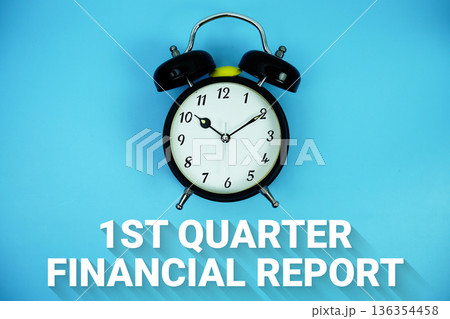 First Quarter Results text and alarm clock on blue background 136354458