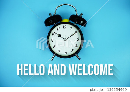 Hello and Welcome text and alarm clock on blue background Hello and Welcome text and alarm clock on blue background 136354469