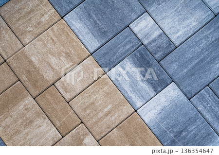 Paving stone texture with rectangular blocks placed diagonally, repeating paving pattern for outdoor surface, construction material, paving solution. Natural background, copy space, mockup design Paving stone texture with rectangular blocks placed diagonally, repeating paving pattern for outdoor surface, construction material, paving solution. Natural background, copy space, mockup design 136354647