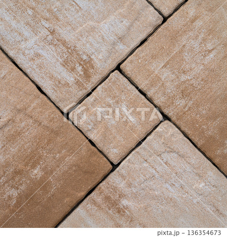 Top view of beige paving tiles with rough matte texture, pattern layout. Concept of paving tiles background, tile texture, construction material 136354673