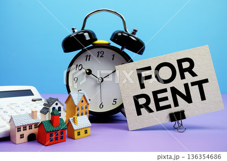 For Rent phrase with Calculator, alarm clock, Model Houses Real Estate Financial Concept For Rent phrase with Calculator, alarm clock, Model Houses Real Estate Financial Concept 136354686