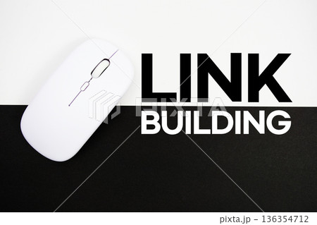 Link Building text and wireless mouse on white and black background Link Building text and wireless mouse on white and black background 136354712