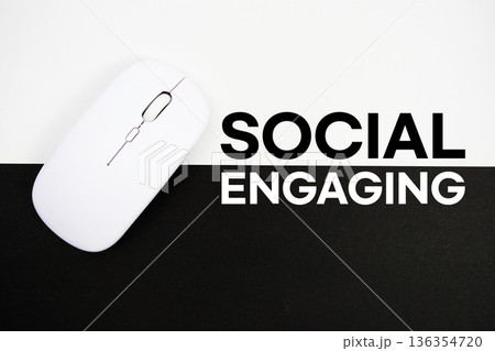 Social Engaging text and wireless mouse on white and black background 136354720