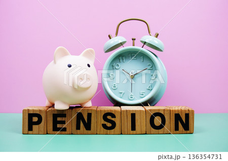 Pension alphabet letters with alarm clock on pink and green background Saving and financial concept Pension alphabet letters with alarm clock on pink and green background Saving and financial concept 136354731
