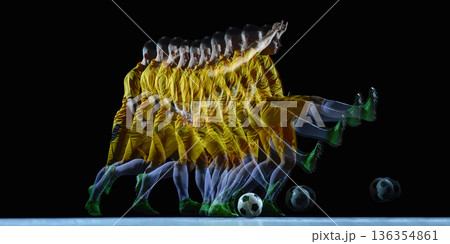 Stroboscopic soccer kick motion sequence in dark studio. Stroboscopic soccer kick motion sequence in dark studio. 136354861
