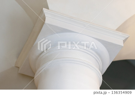A close-up of a white classical column capital A close-up of a white classical column capital 136354909