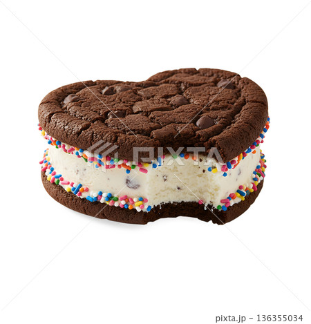 Delicious homemade ice cream sandwich made with chocolate chip cookies, vanilla ice cream, and colorful sprinkles on the edges 136355034