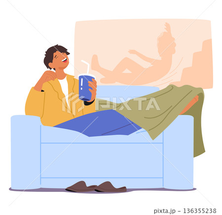 Relaxed young man sitting on sofa, drinking soda and laughing at comedy film enjoying leisure time Relaxed young man sitting on sofa, drinking soda and laughing at comedy film enjoying leisure time 136355238