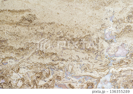 Natural stone surface with layered mineral patterns and organic details forming marble texture. Natural background, stone texture, mineral surface, copy space, mockup for design 136355289