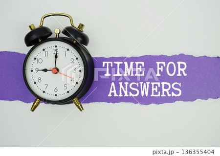 Time For Answers text on purple with white paper torn ripped of horizontal and alarm clock 136355404