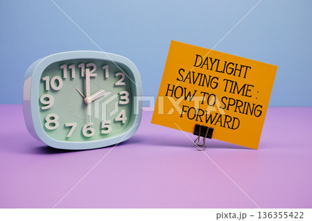 Daylight saving time: How to 'spring forward' text and alarm clock on blue and purple background 136355422