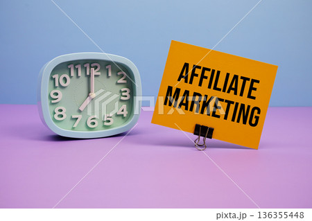 Affiliate Marketing text and alarm clock on blue and purple background 136355448
