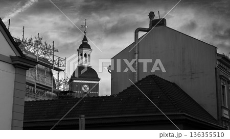 Historic Clock Tower Between Old City Buildings in Black and White 136355510