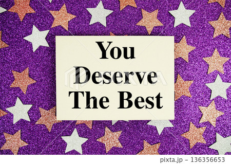 "You Deserve The Best" quotes on paper card with purple glitter background with pink and white stars 136356653
