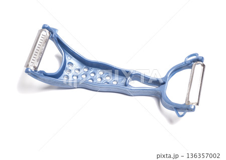 Blue vegetable peeler isolated on white Blue vegetable peeler isolated on white 136357002