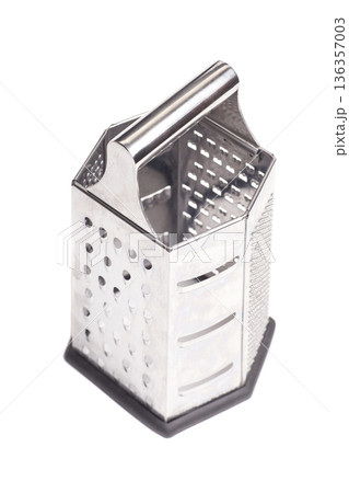 Metal box grater isolated on white Metal box grater isolated on white 136357003