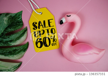 Price tag Sale 60% with summer decorations on pink background 136357331