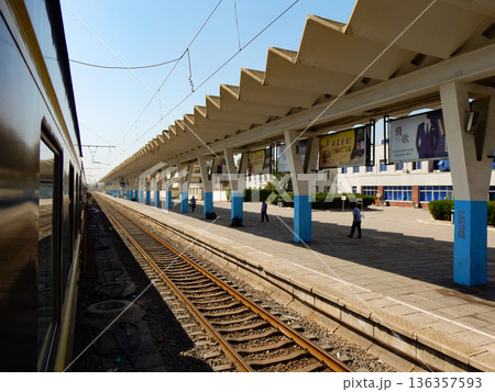 The Trans-Mongolian Train at a Station in China The Trans-Mongolian Train at a Station in China 136357593