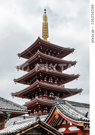 Building view of the Five-storied Pagoda of Kinryu-zan Senso-ji in Asakusa, Tokyo, Japan. The pagoda enshrines the relics of the Buddha, the founder of Buddhism. 136358399