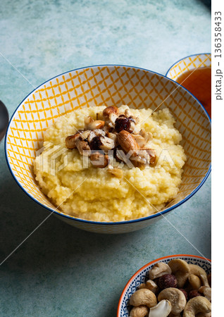 Millet porridge with mixed nuts 136358433