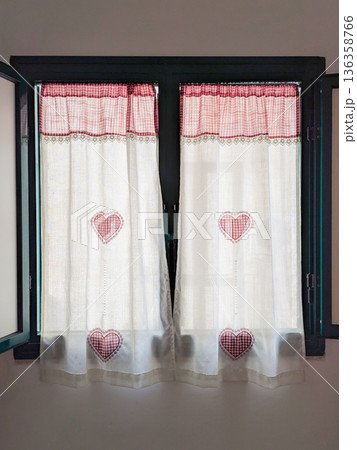 Cozy window textile with stitched hearts, drape pattern feels handmade, drape softness creates calm farmhouse mood, drape detail supports romantic rental, hospitality, decor edits content Cozy window textile with stitched hearts, drape pattern feels handmade, drape softness creates calm farmhouse mood, drape detail supports romantic rental, hospitality, decor edits content 136358766