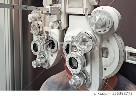 Eyesight exam using modern phoropter, eyesight eyesight screening for clear focus diagnosis 136358772