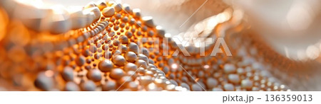 Abstract close-up of golden beads against a blurred background. 136359013