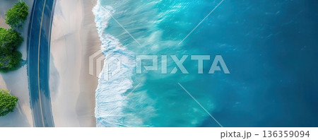 Aerial view of a sandy beach and turquoise ocean waves. 136359094