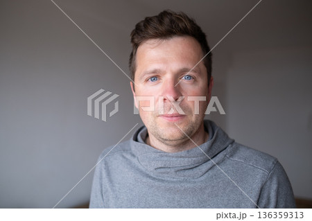 Confident mature male posing with a friendly expression, concept of stability and trust. 136359313