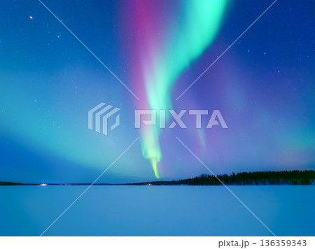 Panoramic horizontal view of the aurora borealis dancing over a frozen lake in Scandinavia. Panoramic horizontal view of the aurora borealis dancing over a frozen lake in Scandinavia. 136359343