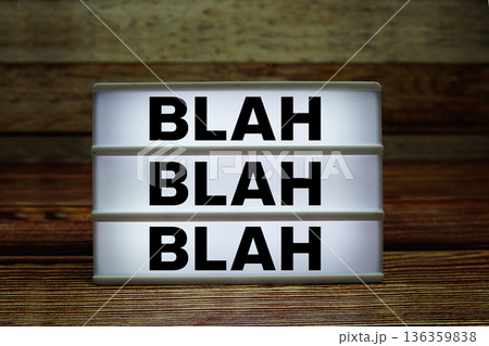Lightbox with text "Blah Blah Blah" on wooden background 136359838