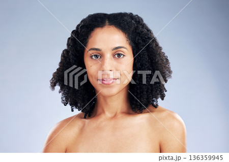 Portrait, beauty and confident with African model woman in studio on a gray background for skincare. Face, aesthetic and natural with a young female person at the salon for serious skin wellness Portrait, beauty and confident with African model woman in studio on a gray background for skincare. Face, aesthetic and natural with a young female person at the salon for serious skin wellness 136359945