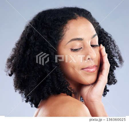Face, skincare touch and woman with beauty in studio isolated on a white background. Natural, cosmetic and African model with spa facial treatment for aesthetic, wellness or health for dermatology 136360025