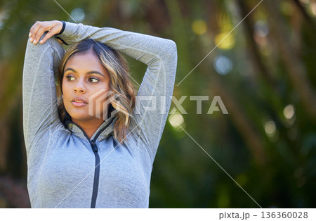 Nature, fitness and young woman doing a warm up for an outdoor workout or training. Sports, happy and female athlete stretching her arms in a park for a running cardio exercise in a green garden. Nature, fitness and young woman doing a warm up for an outdoor workout or training. Sports, happy and female athlete stretching her arms in a park for a running cardio exercise in a green garden. 136360028