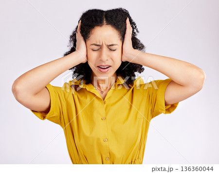 Frustrated woman, headache and anxiety with hands on head in stress against a white studio background. Female person in burnout, fear or ignore with mental health problems, issues or overwhelmed Frustrated woman, headache and anxiety with hands on head in stress against a white studio background. Female person in burnout, fear or ignore with mental health problems, issues or overwhelmed 136360044