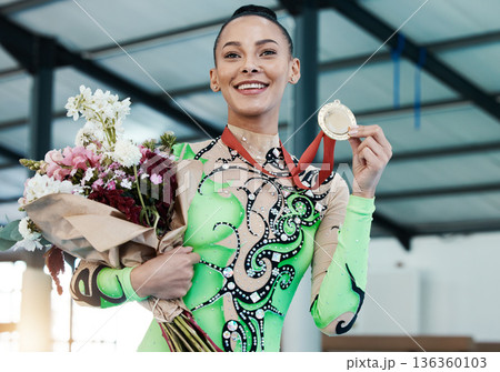 Happy woman, gymnastics and winner, medal and flowers with celebration and winning sports competition. Prize, reward and bonus, female champion on podium with gymnast and athlete smile with gift Happy woman, gymnastics and winner, medal and flowers with celebration and winning sports competition. Prize, reward and bonus, female champion on podium with gymnast and athlete smile with gift 136360103