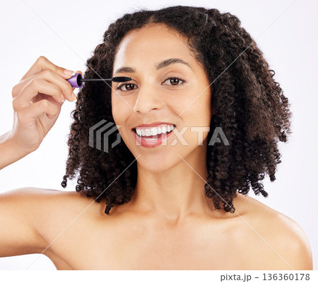 Beauty, mascara and portrait of black woman on a white background for wellness, makeup and cosmetics. Dermatology, cosmetology and face of happy female person with product for eyelashes in studio Beauty, mascara and portrait of black woman on a white background for wellness, makeup and cosmetics. Dermatology, cosmetology and face of happy female person with product for eyelashes in studio 136360178