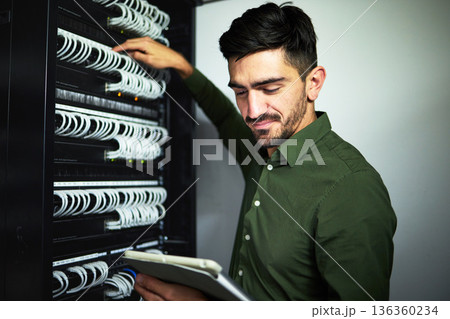 Cable, engineer man and data center with a tablet for programming, maintenance and software upgrade. Male IT technician person with technology in server room for wire, hardware or internet connection Cable, engineer man and data center with a tablet for programming, maintenance and software upgrade. Male IT technician person with technology in server room for wire, hardware or internet connection 136360234