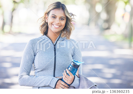 Nature, fitness and portrait of a woman with a water bottle for an outdoor workout or training. Sports, happy and young female athlete with a smile in a park for a running cardio exercise in a garden Nature, fitness and portrait of a woman with a water bottle for an outdoor workout or training. Sports, happy and young female athlete with a smile in a park for a running cardio exercise in a garden 136360235