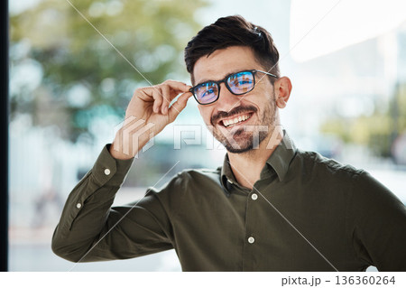 Portrait, face of man and happy with glasses for vision, eyesight and prescription lens. Young male person smile with new frame for designer eyewear, optical fashion and assessment in eye care clinic Portrait, face of man and happy with glasses for vision, eyesight and prescription lens. Young male person smile with new frame for designer eyewear, optical fashion and assessment in eye care clinic 136360264