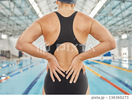 Hands, injury and back pain at swimming pool with woman during training, exercise or accident. Sport, swim and athlete with spine problem, arthritis or fibromyalgia, osteoporosis or medical emergency Hands, injury and back pain at swimming pool with woman during training, exercise or accident. Sport, swim and athlete with spine problem, arthritis or fibromyalgia, osteoporosis or medical emergency 136360273