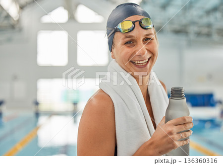 Portrait, swimming pool and happy woman with bottle for water after workout, training or exercise. Face, funny and excited swim athlete from Australia ready for fitness, health and wellness laugh Portrait, swimming pool and happy woman with bottle for water after workout, training or exercise. Face, funny and excited swim athlete from Australia ready for fitness, health and wellness laugh 136360316