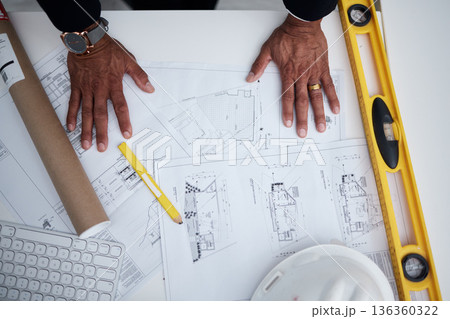 Top view of man, hands and architect with blueprint, project illustration and engineering process. Closeup of designer with documents, floor plan and stationery tools to sketch planning of buildings Top view of man, hands and architect with blueprint, project illustration and engineering process. Closeup of designer with documents, floor plan and stationery tools to sketch planning of buildings 136360322