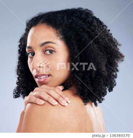Skin, beauty and a woman with hand on shoulder for dermatology, cosmetics and natural makeup. Portrait of African female model on a studio background for self care, glow and soft touch with manicure Skin, beauty and a woman with hand on shoulder for dermatology, cosmetics and natural makeup. Portrait of African female model on a studio background for self care, glow and soft touch with manicure 136360370
