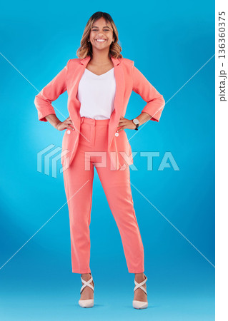 Fashion, happy and portrait of business woman in studio confident for career, job and startup. Corporate, professional and female person with trendy clothes, pride and formal style on blue background Fashion, happy and portrait of business woman in studio confident for career, job and startup. Corporate, professional and female person with trendy clothes, pride and formal style on blue background 136360375