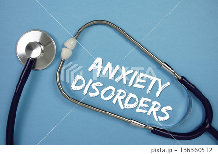 Anxiety Disorders text with stethoscope on blue background 136360512