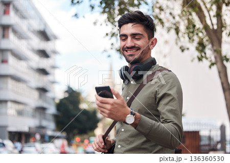 Travel, city and man with a phone outdoor for communication, connection or chat. Happy male student on urban street with smartphone and network for reading social media or navigation app notification Travel, city and man with a phone outdoor for communication, connection or chat. Happy male student on urban street with smartphone and network for reading social media or navigation app notification 136360530